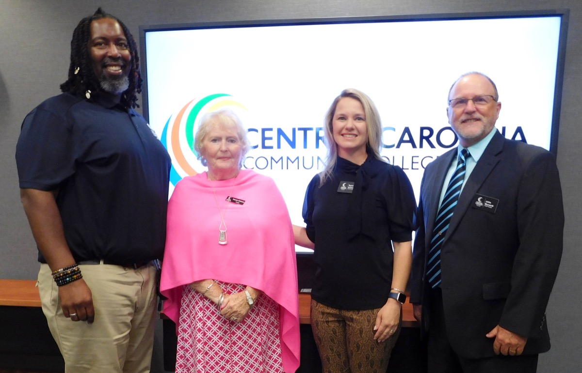 Click to enlarge,  Central Carolina Community College's new and reappointed Trustees were pictured at the CCCC Board of Trustees' meeting on Wednesday, August 2, 2023. Pictured are, left to right: Regonal Spinks (who serves as CCCC Student Government Association President) and Trustees Patricia Kirkman, Taylor Vorbeck, and John Bonardi. 