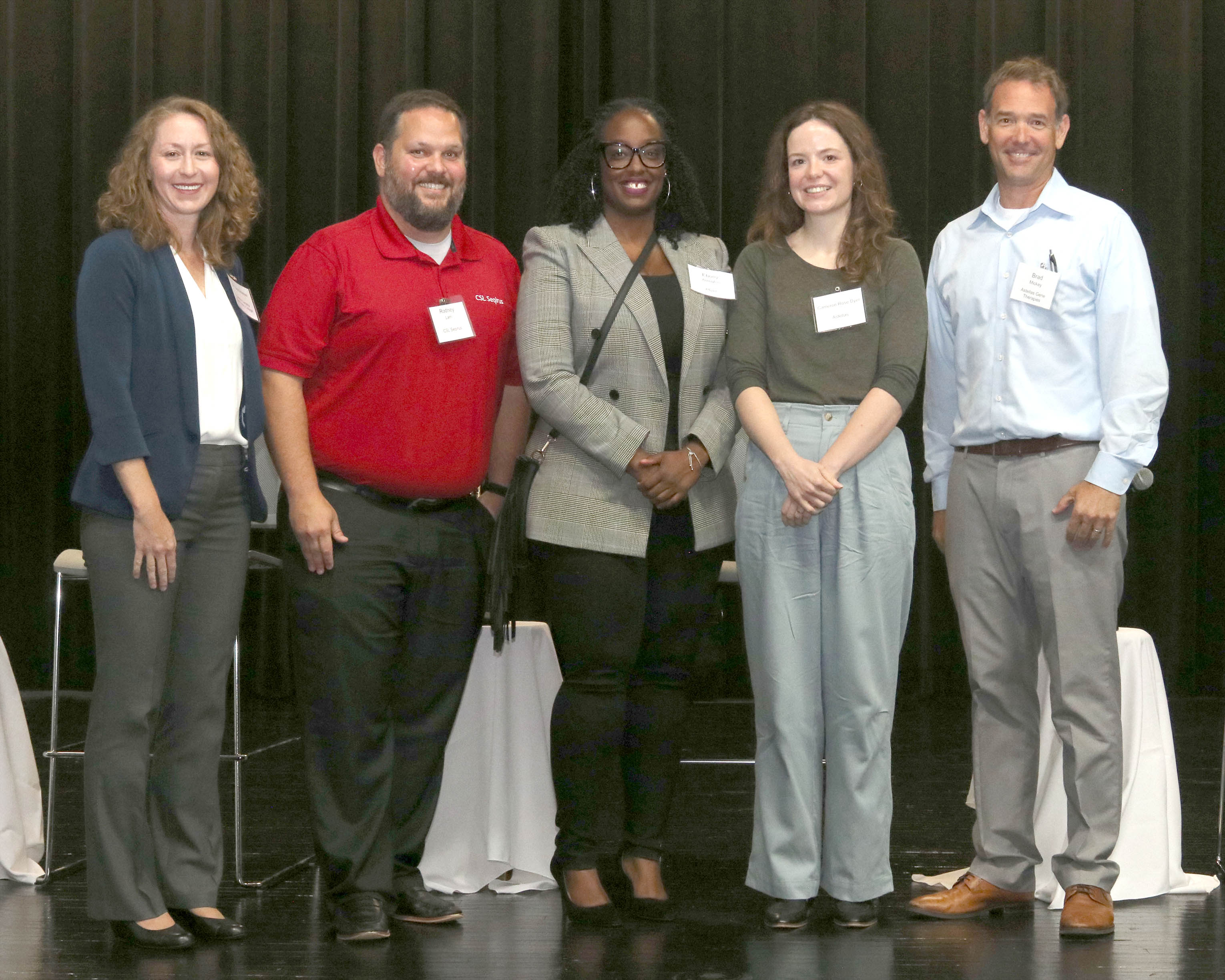 Click to enlarge,  Dr. Lisa Smelser (left), Central Carolina Community College Biotechnology Department Chair, visits with (left to right) Rodney Lam from CSL Seqirus, Ebony Arrington from Pfizer, Cameron Rose Dyer from Astellas Gene Therapies and Brad Mickey from Astellas Gene Therapies. 