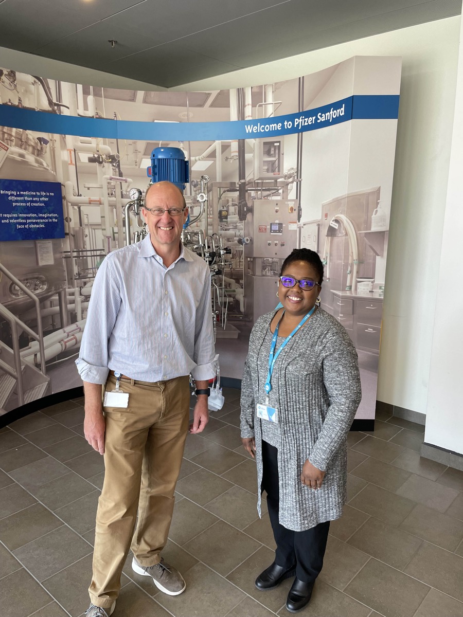 Click to enlarge,  Dr. Brenda Grubb (right) is pictured with Jon Tucker, Site Leader at Pfizer in Sanford, N.C. 