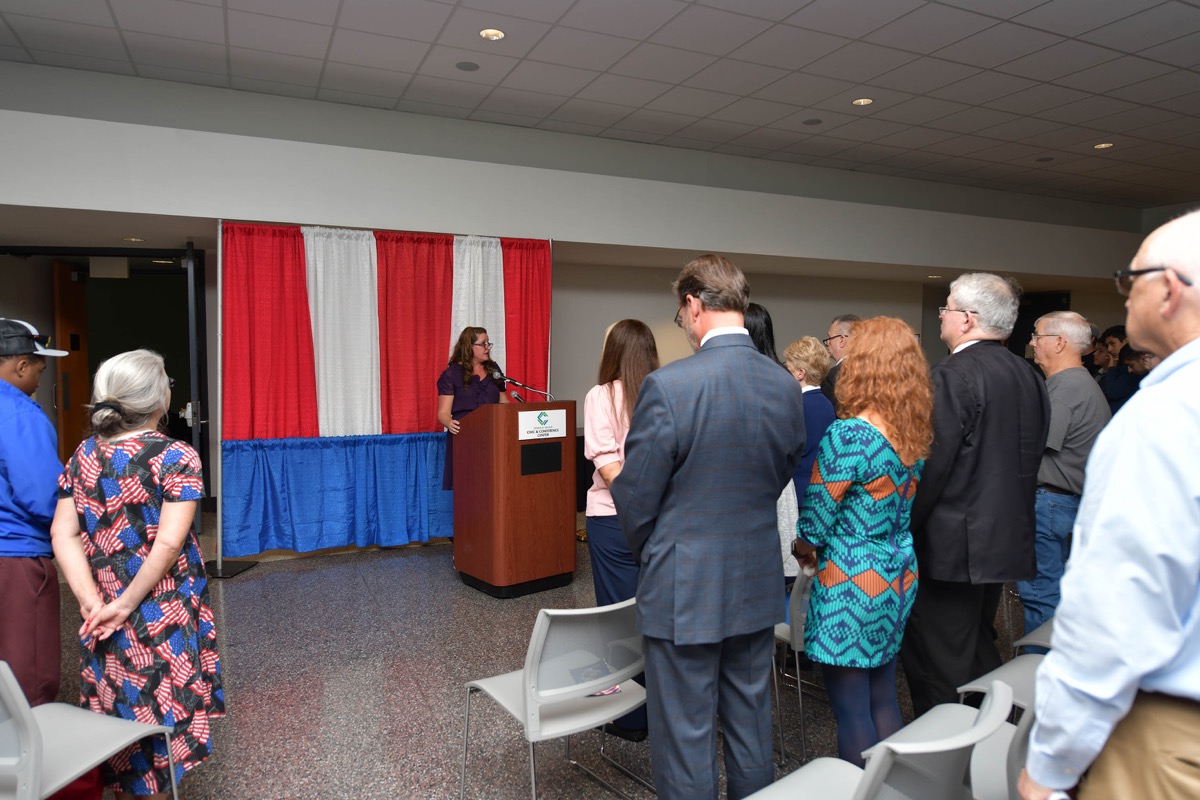 Click to enlarge,  Jennifer Dillon, CCCC's Director of Veterans Upward Bound and Military Initiatives, speaks at the CCCC Veterans Day commemoration. 