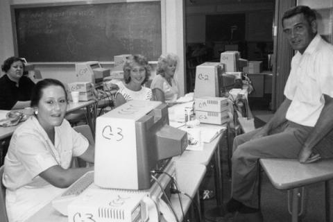 Historical image of students working with early computers