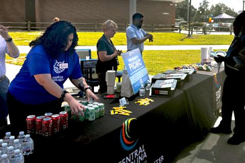 Students organizing goodies to hand out to students 