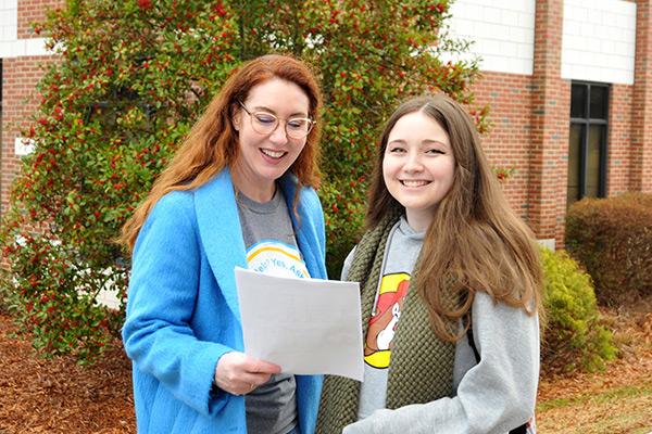 Advisor providing new student with directions