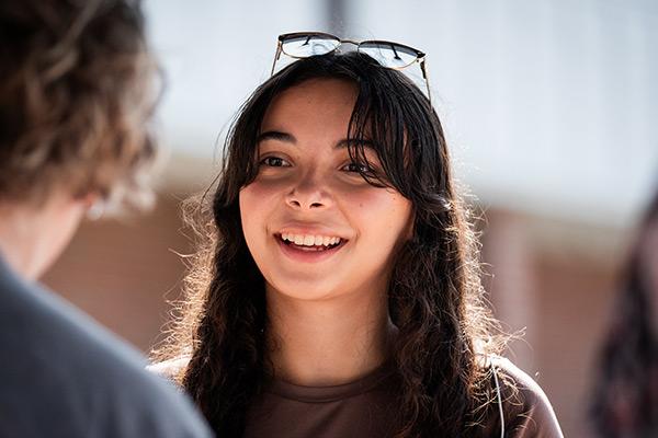 Returning student happy to be seeing friends again