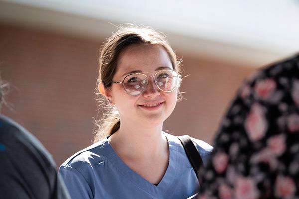 New student talking to friends while on campus