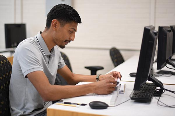 Student studying in front of computer