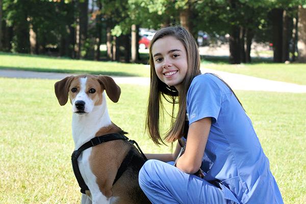 Vet med student with dog