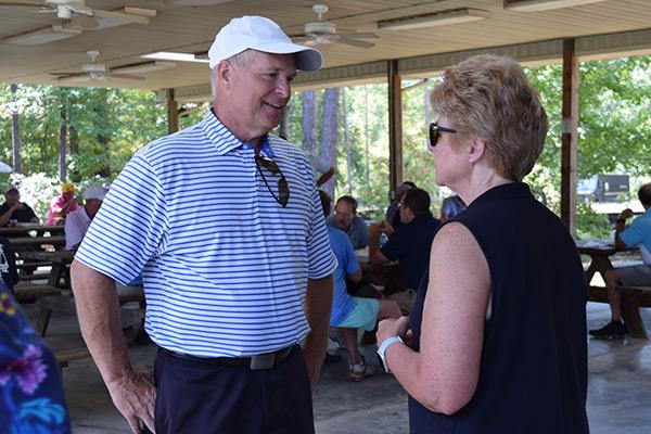 Dr. Chapman in conversation at golf classic