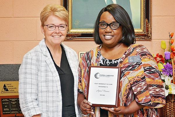 Dr. Chapman presenting award to April Raines, 2024-2025 Staff Member of the Year