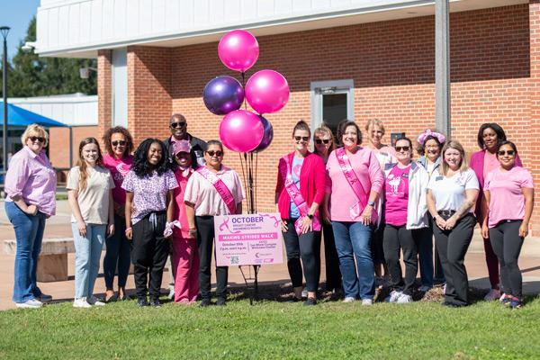 College employees gathered to support cancer survivors